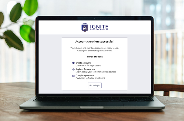 Laptop screen showing an account creation successful message and the next two steps to register for courses and make payment.
